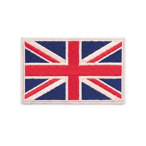 May include: A rectangular embroidered patch featuring the Union Jack flag design. The patch displays a central red cross with white borders, set against a dark blue background with diagonal white and red stripes, finished with a stitched border.