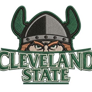May include: An embroidered patch featuring a Viking mascot wearing a grey and black helmet with green horns, positioned above the text CLEVELAND STATE in green block letters with a white outline, all set against a solid white background.
