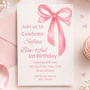 May include: A rectangular white birthday invitation card featuring a large watercolor pink ribbon bow at the top. The text reads: Join us to Celebrate Sofias Bow-tiful 1st Birthday, Saturday 30th Jan, 123 City Drive, Town 1234, 10 am till 3 pm, RSVP to Jess 10th Jan, 0412 345 678.