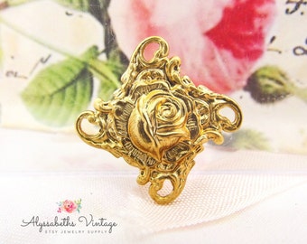 Puede incluir: Encanto de rosa de metal dorado con detalles intrincados. La rosa está rodeada de un marco decorativo. Este encanto es perfecto para la elaboración de joyas o manualidades.