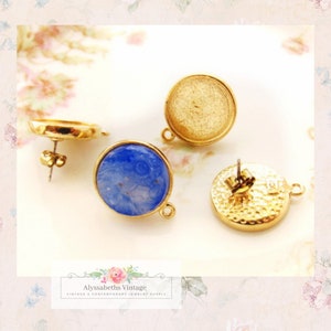 May include: Gold-toned round earring components with a blue stone and a textured back. One earring is assembled, showing the post and backing. The image also shows the brand name "Alyssabeths Vintage".