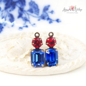 May include: Two vintage-style earring components. Each features a red, round gemstone atop a blue, rectangular gemstone. The metal setting has an aged, bronze finish. The Etsy shop name "Alyssabeths Vintage" is in the upper right corner.