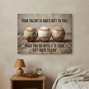 May include: A rectangular wall canvas featuring three baseballs lined up on a weathered wooden surface. The text reads: YOUR TALENT IS GOD'S GIFT TO YOU. WHAT YOU DO WITH IT IS YOUR GIFT BACK TO GOD. The background has a rustic, neutral tone.