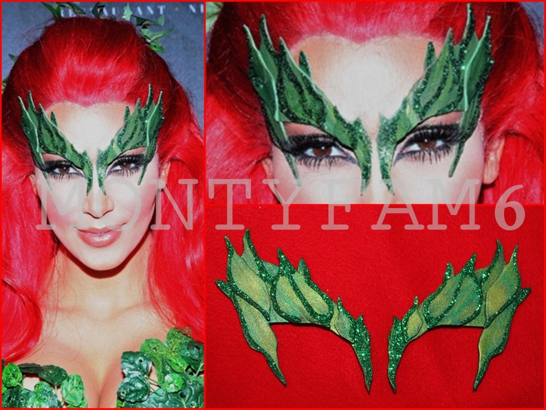 May include: Green glitter eye makeup with a leaf design. The makeup is applied to a person's face. The makeup is designed to look like Poison Ivy from the Batman comics.