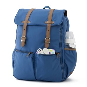 May include: A blue diaper bag backpack with brown straps and multiple pockets. The bag has a bottle holder on the side and a zippered pocket on the front.