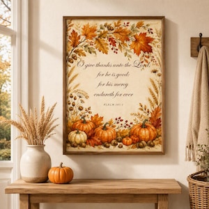 May include: A rectangular framed wall art print featuring a cream background with a border of autumn leaves, wheat, and berries. The text reads: O give thanks unto the Lord, for he is good: for his mercy endureth for ever. PSALM 107:1.