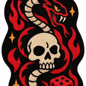 May include: A tufted rug featuring a black background with a central beige skull, a coiled snake with red and beige scales, and red flames. A red die with black dots sits at the bottom right, accented by small yellow four-pointed stars.