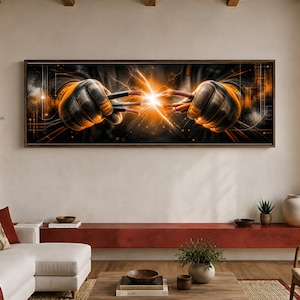 May include: A panoramic wall art piece featuring two gloved hands reaching toward each other, with exposed electrical wires emitting a bright orange spark of electricity between them against a dark, abstract background with orange grid lines.