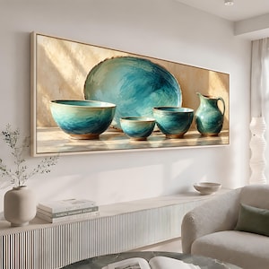 May include: A rectangular wall art print featuring a still life composition of a large oval platter, two bowls of varying sizes, and a pitcher. The ceramic pieces display a vibrant teal and blue watercolor-style finish with warm beige highlights.