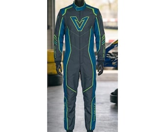 May include: A charcoal grey racing suit featuring blue and neon green accents. The suit has a prominent blue V-shaped logo on the chest, long sleeves with neon green chevron patterns, and the word VELOCITY printed vertically on the lower leg.