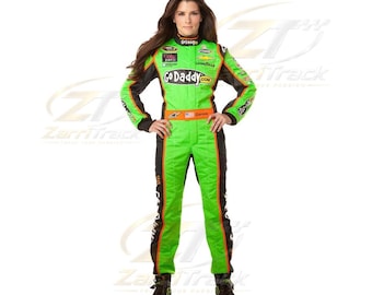 May include: A bright green and black racing suit featuring the GoDaddy.com logo on the chest, various sponsor patches, a high collar, long sleeves, and full-length trousers. The suit includes an orange waist belt and black racing shoes.
