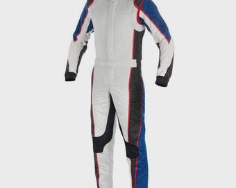 May include: A full-body racing suit featuring a white base with prominent blue and black side panels. The garment includes a high collar, long sleeves, and red piping accents along the seams, creating a structured look for high-speed activities.