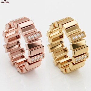 May include: Two rings, one in rose gold and one in yellow gold, featuring a segmented, block-like band design. Each ring includes two sections embedded with four small, clear, round-cut stones. The Habib logo is visible in the top left corner.