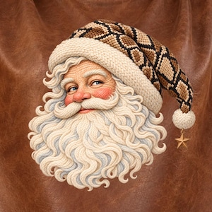 May include: A brown short-sleeved crop top featuring a graphic print of Santa Claus. The Santa figure has a long white beard and wears a hat with a brown and tan snakeskin-like pattern, a cream-colored brim, and a small gold star charm at the tip.