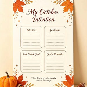 May include: A cream-colored planner sheet titled My October Intention with four sections labeled Intention, Gratitude, One Small Goal, and Gentle Reminder. The border features orange maple leaves and small stars, with the text Slow down, breathe deeply, notice the magic at the bottom.