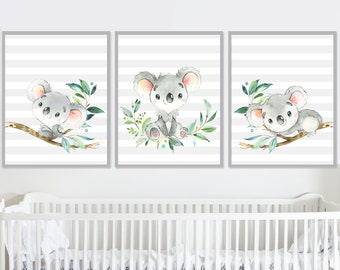 May include: Three watercolor prints featuring cute koala bears on branches with green leaves against a gray and white striped background. The prints are perfect for a nursery or child's room.