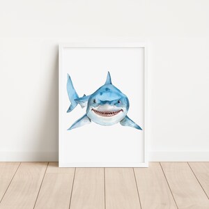 May include: A watercolor painting of a great white shark with a toothy grin. The shark is blue and white and is swimming towards the viewer.