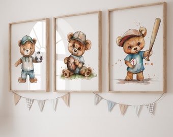 May include: Three watercolor illustrations of brown teddy bears wearing baseball uniforms. The first bear is holding a soccer ball, the second is holding a football, and the third is holding a baseball bat.