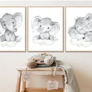 May include: Three black and white watercolor illustrations of elephants on clouds. Each elephant has a different expression. The first elephant is sitting up, the second elephant is looking up, and the third elephant is sleeping.