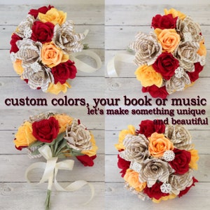 Puede incluir: Un ramo de rosas de papel hechas con p&aacute;ginas de libros en tonos rojos, naranjas y amarillos. Las rosas est&aacute;n atadas con una cinta blanca. El texto "custom colors, your book or music let's make something unique and beautiful" est&aacute; escrito debajo del ramo.