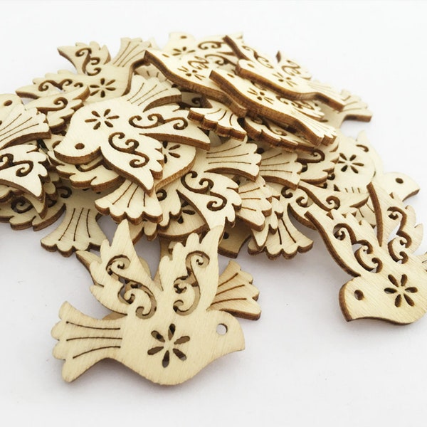 Lots of wooden accessories birds hearts trees of life to paint and decorate DIY crafts home decoration jewelry creation