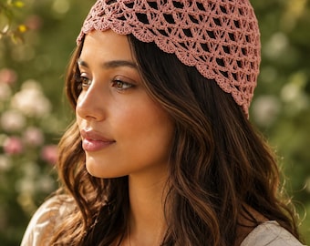May include: A dusty rose crochet cap featuring an intricate openwork diamond pattern and a scalloped edge. The headwear is constructed with fine yarn, creating a lightweight, breathable texture that fits snugly around the crown of the head.