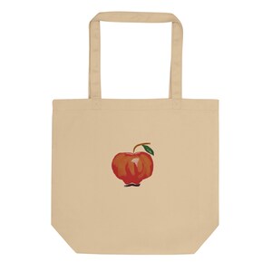 Bolso de tela ecológico color canela (100 % algodón orgánico) con estampado digital de manzana roja, ideal para la recolección de manzanas y el estilo otoñal.