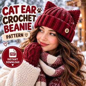 May include: A deep red crochet beanie with cat ears and a small wooden paw print tag. The text CAT EAR CROCHET BEANIE PATTERN is displayed in the upper left, with a circular badge in the lower left stating PDF INSTANT DOWNLOAD.