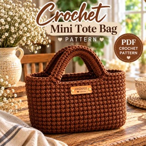 May include: A brown crochet mini tote bag with two handles and a rectangular leather-like tag on the front that reads HANDMADE with love. The text Crochet Mini Tote Bag PATTERN and PDF CROCHET PATTERN are visible in the background of the image.