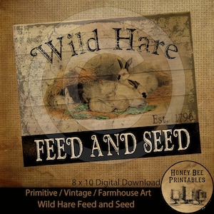 May include: A vintage-style sign with a rustic brown background and black lettering. The sign reads "Wild Hare Est. 1796 FEED AND SEED". The sign features an illustration of a family of rabbits in a nest of hay.