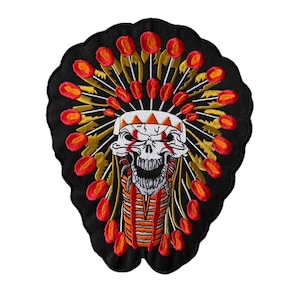 May include: An embroidered patch on a black background featuring a white skull wearing a large, circular headdress. The headdress is composed of yellow and gold feathers tipped with vibrant red, arranged in a sunburst pattern around the skull.