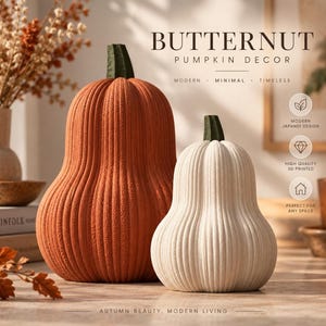 May include: Two butternut pumpkin decor pieces, one large orange and one smaller white, both featuring vertical ribbed textures and dark green stems. Text on the image reads: BUTTERNUT PUMPKIN DECOR, MODERN, MINIMAL, TIMELESS, MODERN JAPANDI DESIGN, HIGH QUALITY 3D PRINTED, PERFECT FOR ANY SPACE, AUTUMN BEAUTY, MODERN LIVING.