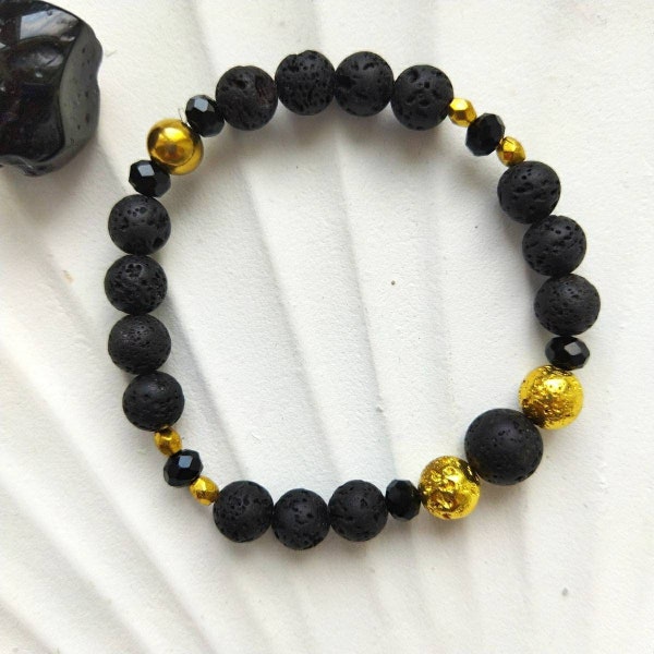BRASSARD avec des perles de lave noires et dorées | Brassard de surf édition Black Gem