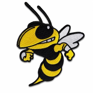 May include: An embroidered patch featuring a cartoon wasp with a yellow and black striped body, a large black eye, and white wings. The design is outlined in black thread, showcasing a dynamic pose with raised arms and a pointed stinger.