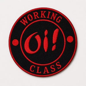 May include: A circular embroidered patch featuring a black background with a red border. The text "WORKING" is arched at the top and "CLASS" at the bottom in red. The center displays the red text "Oi!" with a red dot on each side.