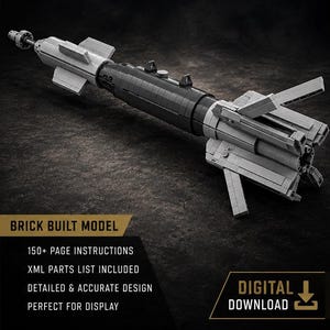 May include: A brick-built model of a GBU-12 Paveway II laser-guided bomb. The model features a black cylindrical body with light gray fins at both ends. Text on the image includes GBU-12 Paveway II Laser Guided Bomb, Hardpoint Brickworks, and Brick Built Model.
