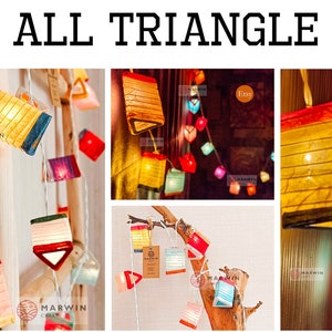 May include: String lights with colorful, geometric paper lanterns in various shapes, including triangles and rectangles. The lanterns are lit from within, creating a warm glow. The text "ALL TRIANGLE" is at the top.