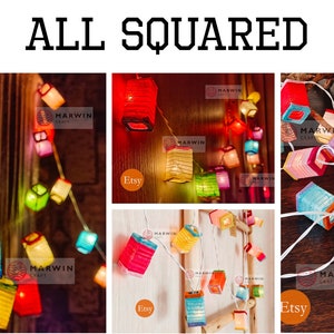 May include: String of colorful, square paper lanterns in red, blue, yellow, and green. The lanterns are strung on a white wire and are lit. The text "ALL SQUARED" is at the top of the image.