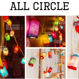 May include: String of colorful paper lanterns, each with a unique design and hue, including red, yellow, and blue. The lanterns are strung together, creating a festive and decorative lighting display. Text on the image reads "ALL CIRCLE".