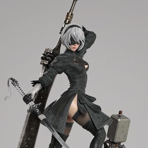 May include: A detailed collectible figure of a character with short white hair and a black blindfold, wearing a black dress with high-heeled boots. The figure holds a large sword and stands on a rocky base with small white flowers and a robot.