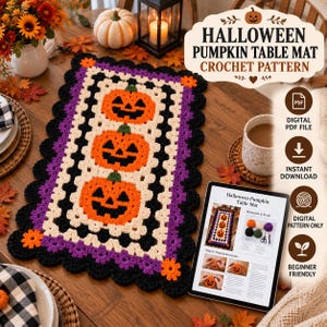 May include: A rectangular crochet table mat featuring three orange jack-o'-lantern pumpkins with black faces, centered on a cream background, bordered by purple and black scalloped edges with small orange flower accents at the corners.