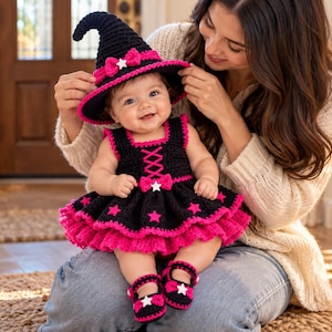 May include: A black and hot pink crocheted baby outfit consisting of a pointed witch hat with a bow, a sleeveless dress with a lace-up bodice and star accents, and a pair of matching Mary Jane style shoes with white star embellishments.