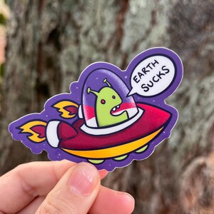 Unimpressed Alien in UFO Spacecraft, Funny Sticker, Vinyl Waterproof Stickers for Journal, Planners, Laptops, Water Bottle, and Phone Case