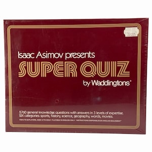 May include: A rectangular board game box in deep maroon with gold lettering. The text reads Isaac Asimov presents SUPER QUIZ by Waddingtons. It includes 5760 general knowledge questions in six categories for 2 to 30 players, ages 12 to adult.