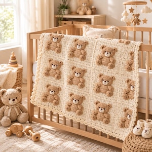 May include: A cream-colored crochet blanket featuring a repeating pattern of light brown teddy bear appliques in square sections, finished with a scalloped border. The blanket is draped over the wooden slats of a crib in a nursery setting.