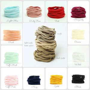 May include: Assortment of 14 colors of fabric hair ties, including light blue, dusty rose, red, burgundy, peach, light nude, soft mint, nude, cream, dark nude, white, soft pink, navy, gold, and black.