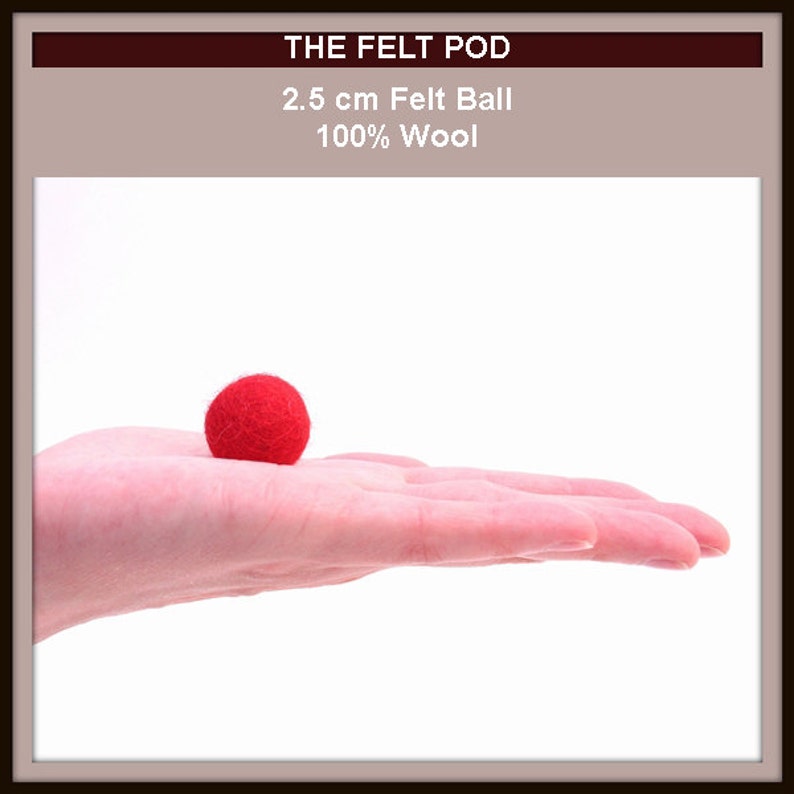 May include: A 2.5 cm red felt ball made of 100% wool, resting on a hand. The felt ball is a soft, round, and fuzzy craft supply.