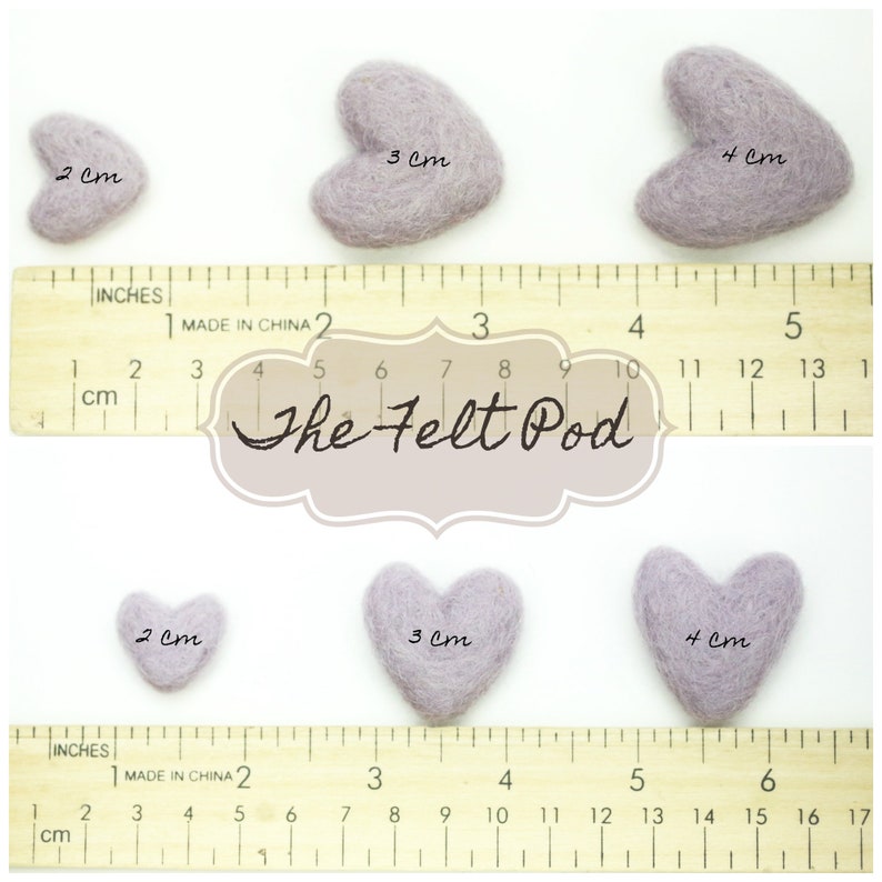May include: Three felt heart shapes in different sizes, 2 cm, 3 cm, and 4 cm, with a ruler for reference. The felt hearts are a light purple color. The image includes the text "The Felt Pod".