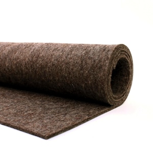 May include: A roll of brown felt fabric. The felt is rolled up and the end of the roll is visible.