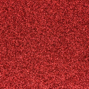 May include: A close-up of a red glitter background. The glitter is very fine and creates a sparkling effect.